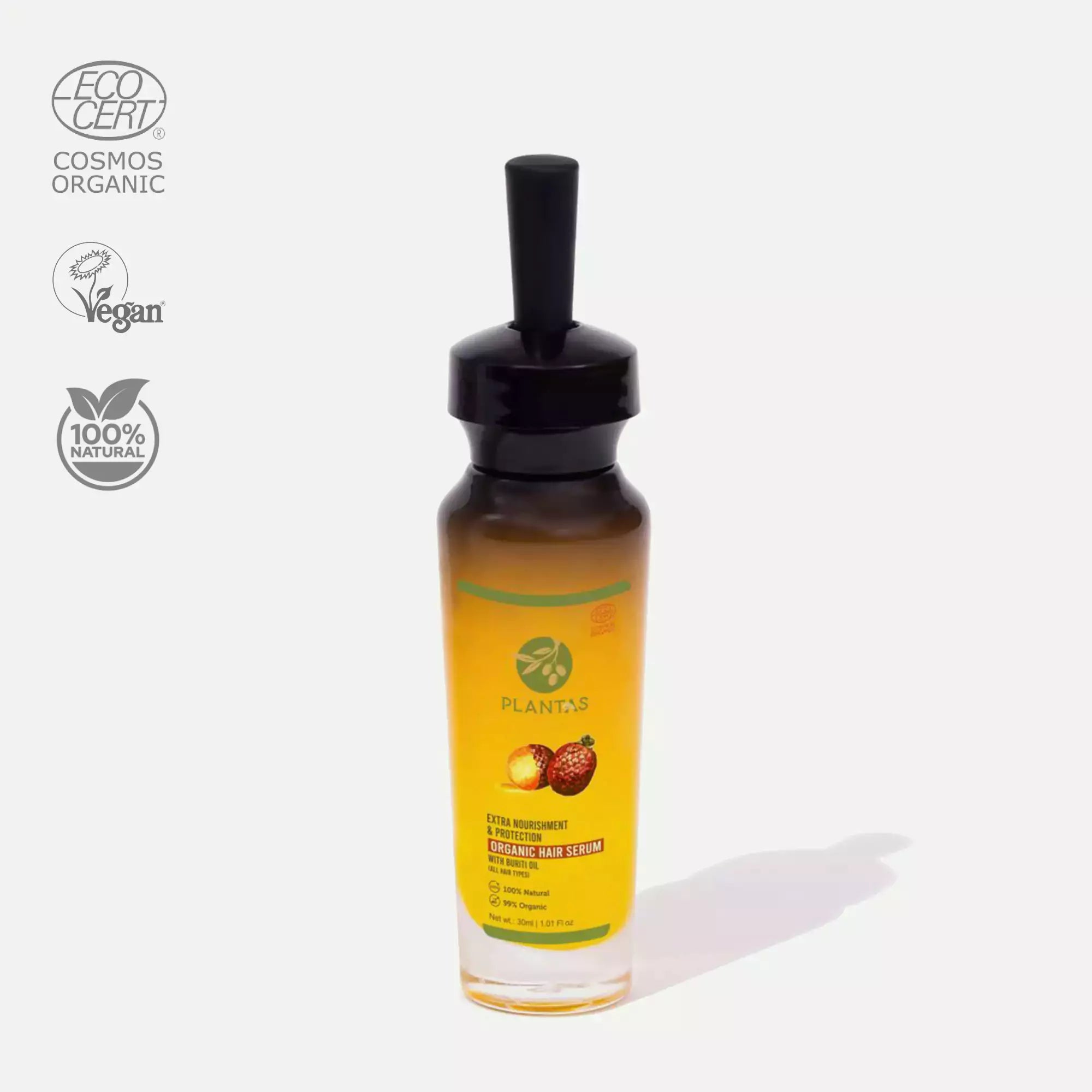A bottle of Plantas Organic Hair Oil with a pump dispenser, next to its packaging box which has 'Cosmos Organic' and '100% Organic' seals, indicating the product is organic.
